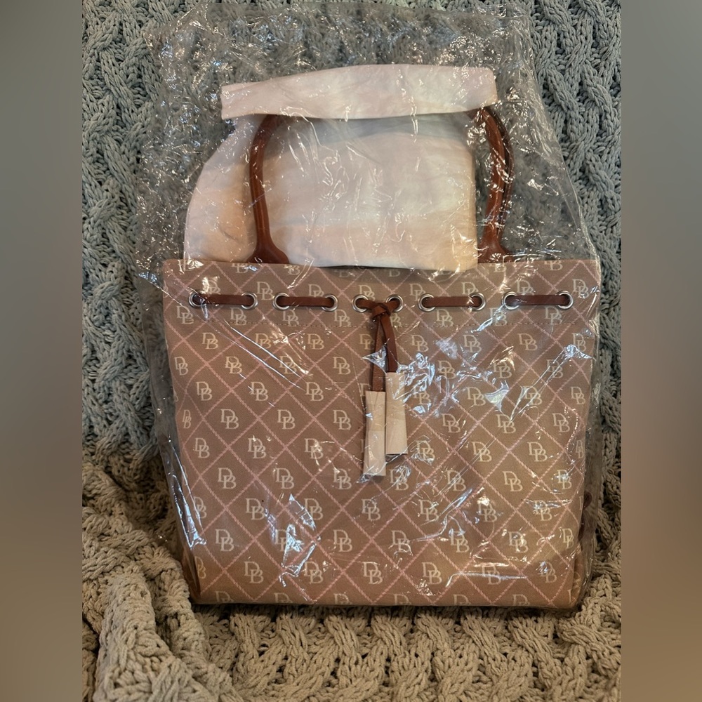 Vintage 2006 Dooney and Bourke tulip tassel tote. Never taken out of bag.